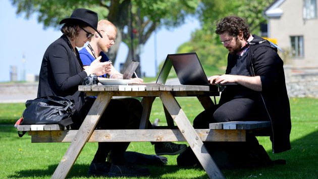 Three of the 2016 jurors, hard at work jotting down feedback and discussing the projects they've seen
